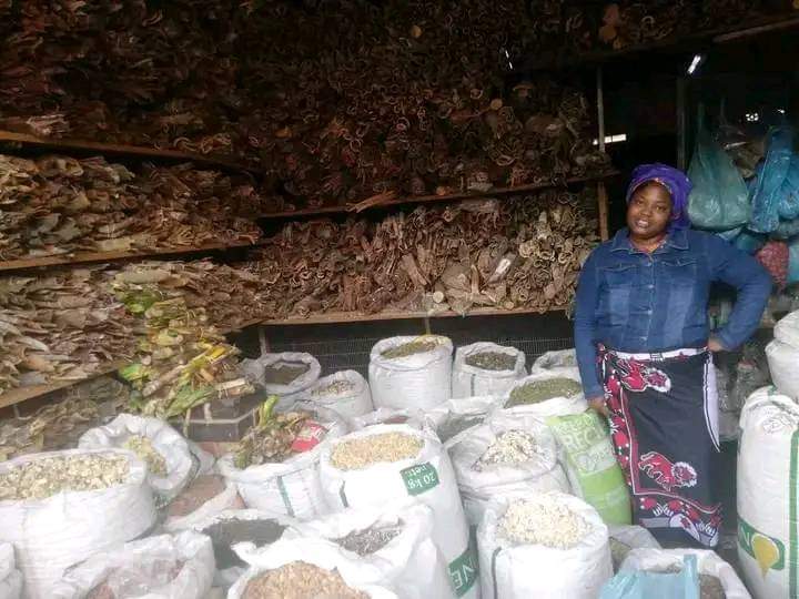 Our founder, Duduzile Nemaname, stands proudly next to the herbs, embodying our commitment to traditional healing and holistic wellness.