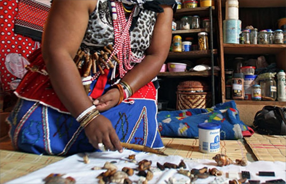 A traditional healer, deeply connected to ancestral wisdom and spiritual healing, guiding individuals on their journey to wellness.